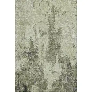 Photo of 8' Artichoke Green Charcoal And Ivory Abstract Washable Area Rug With UV Protection