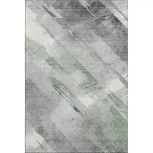 Photo of 8' Artichoke Green Charcoal And Ivory Striped Washable Area Rug With UV Protection