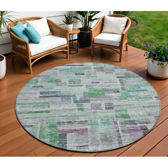8' Artichoke Green Charcoal And Purple Round Striped Washable Indoor Outdoor Area Rug Photo 1