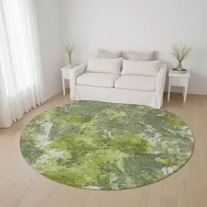 Photo of 8' Artichoke Green Gray And Ivory Abstract Washable Round Rug With UV Protection