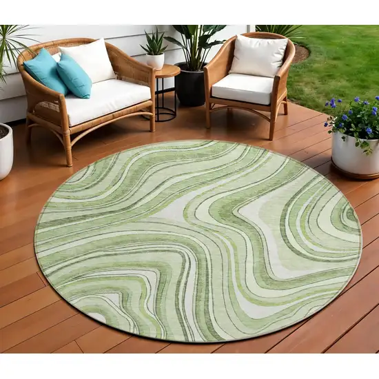 8' Artichoke Green Green And Ivory Round Abstract Washable Indoor Outdoor Area Rug Photo 1