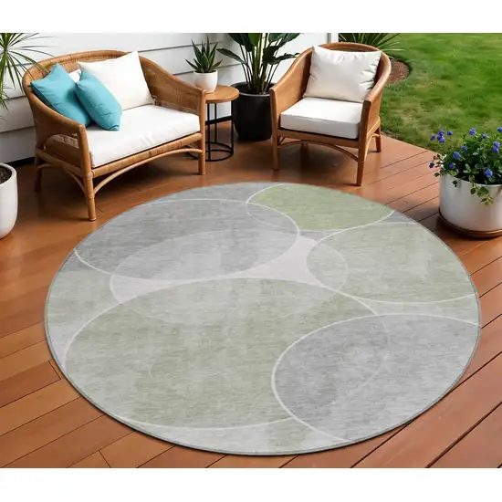 8' Artichoke Green Green And Ivory Round Geometric Washable Indoor Outdoor Area Rug Photo 1