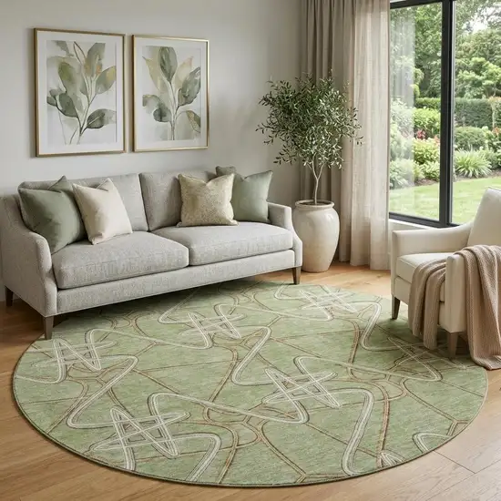 8' Artichoke Green Ivory And Beige Geometric Washable Round Rug With UV Protection Photo 1