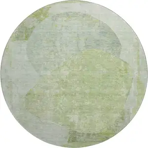 Photo of 8' Artichoke Green Ivory And Gray Abstract Washable Round Rug With UV Protection