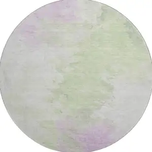 Photo of 8' Artichoke Green Ivory And Lavender Abstract Washable Round Rug With UV Protection