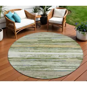 Photo of 8' Artichoke Green Ivory And Tan Round Striped Washable Indoor Outdoor Area Rug