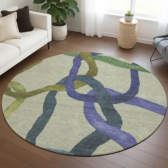 8' Artichoke Green Purple And Khaki Round Abstract Washable Indoor Outdoor Area Rug Photo 5