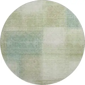 Photo of 8' Artichoke Green Teal Blue And Beige Abstract Washable Round Rug With UV Protection