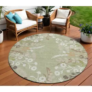 Photo of 8' Artichoke Green Wheat And Ivory Round Floral Washable Indoor Outdoor Area Rug