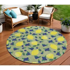 Photo of 8' Artichoke Green Yellow And Blue Round Lemons Washable Indoor Outdoor Area Rug
