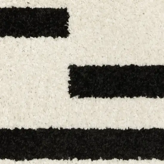 7' Beige And Black Abstract Runner Rug Photo 8