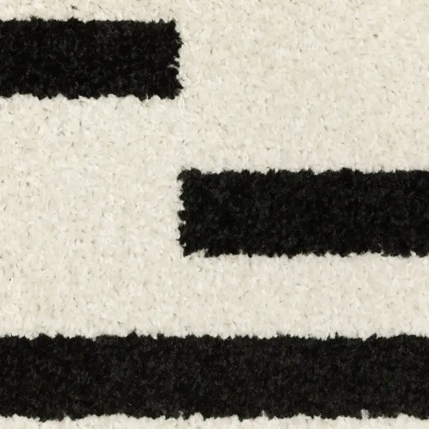 7' Beige And Black Abstract Runner Rug Photo 8