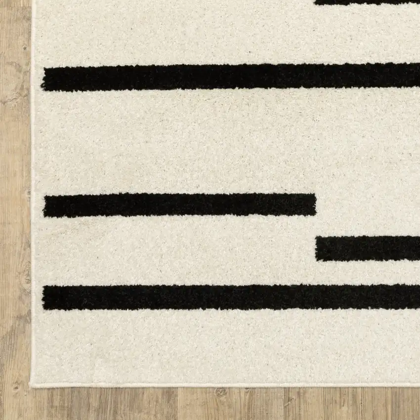7' Beige And Black Abstract Runner Rug Photo 9