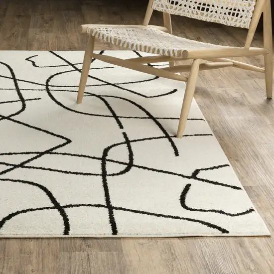 7' Beige And Black Abstract Runner Rug Photo 5