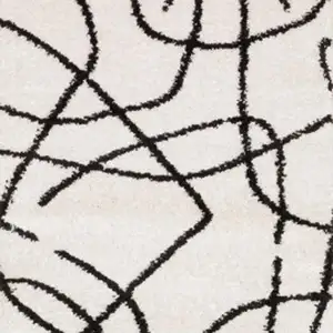 Photo of 7' Beige And Black Abstract Runner Rug