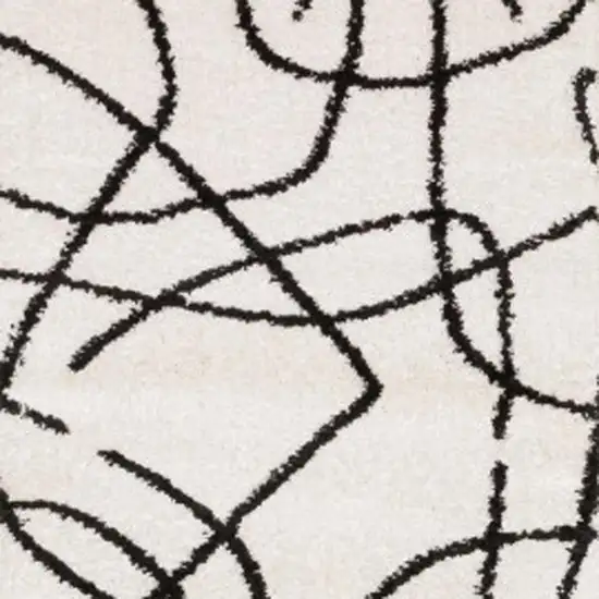 7' Beige And Black Abstract Runner Rug Photo 4