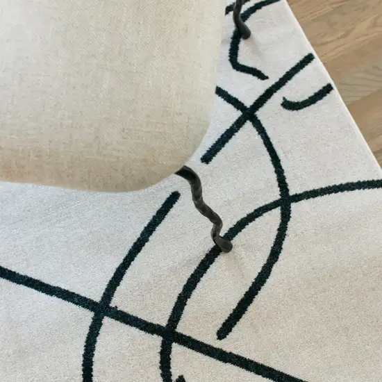 7' Beige And Black Abstract Runner Rug Photo 8