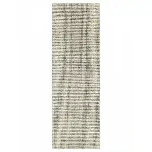 Photo of 8' Beige And Black Checkered Area Rug