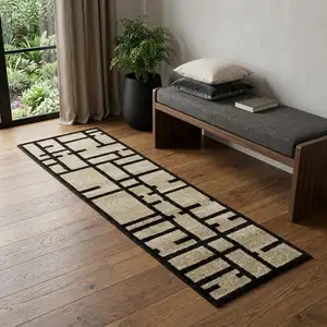 Photo of 7' Beige And Black Geometric Runner Rug