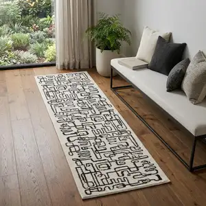 Photo of 7' Beige And Black Geometric Runner Rug