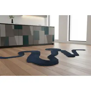 Photo of 5' Beige And Blue Abstract Washable Round Rug With UV Protection