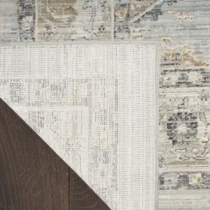 Photo of 8' Beige And Blue Floral Medallion Distressed Runner Rug With Fringe