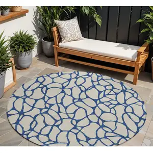Photo of 8' Beige And Blue Round Geometric Washable Indoor Outdoor Area Rug