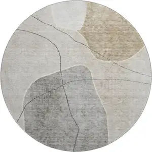 Photo of 8' Beige And Brown Abstract Washable Round Rug With UV Protection