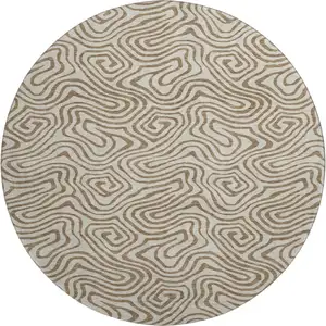 Photo of 8' Beige And Brown Abstract Washable Round Rug With UV Protection