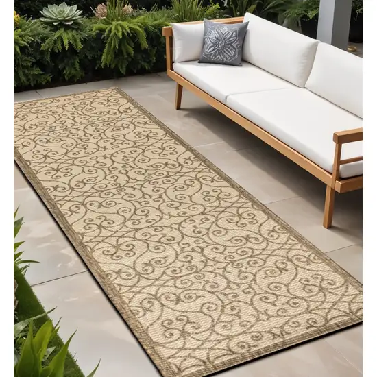 8' Beige And Brown Geometric Indoor Outdoor Runner Rug Photo 1