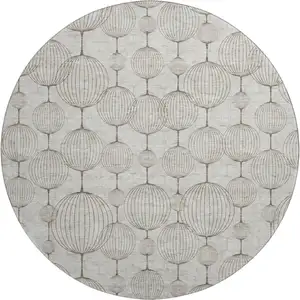 Photo of 8' Beige And Brown Geometric Washable Round Rug With UV Protection