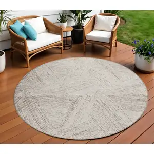 Photo of 8' Beige And Brown Round Abstract Washable Indoor Outdoor Area Rug