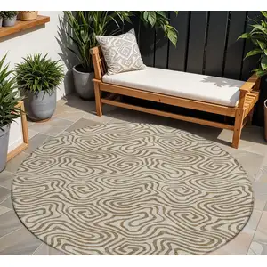 Photo of 8' Beige And Brown Round Abstract Washable Indoor Outdoor Area Rug