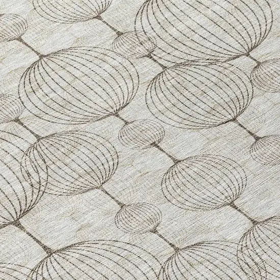 8' Beige And Brown Round Geometric Washable Indoor Outdoor Area Rug Photo 9