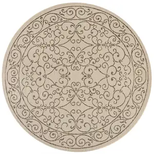 Photo of 9' Beige And Brown Round Medallion Indoor Outdoor Area Rug