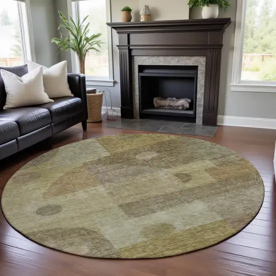 8' Beige And Gold Geometric Washable Round Rug With UV Protection Photo 4
