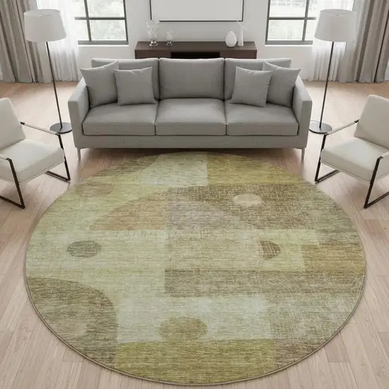 8' Beige And Gold Geometric Washable Round Rug With UV Protection Photo 2