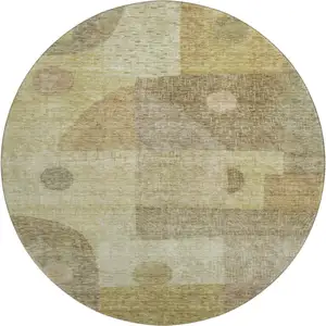 Photo of 8' Beige And Gold Geometric Washable Round Rug With UV Protection