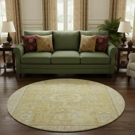 8' Beige And Gold Oriental Washable Round Rug With UV Protection Photo 2