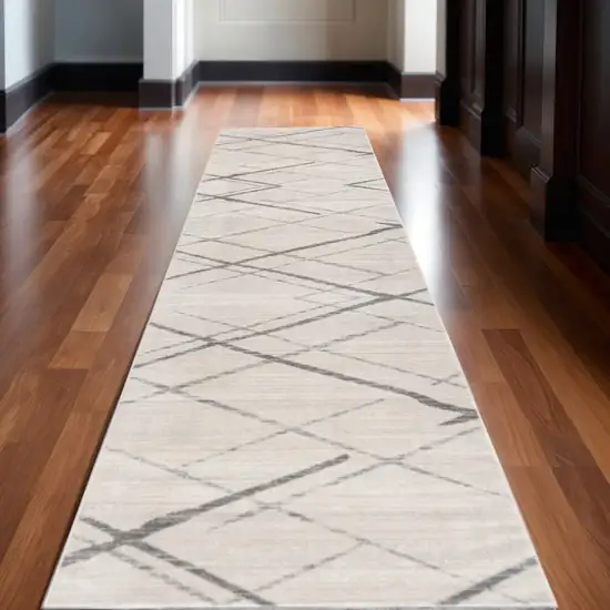 11' Beige And Gray Abstract Runner Rug Photo 1