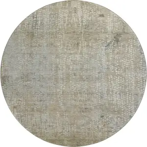 Photo of 8' Beige And Gray Abstract Washable Round Rug With UV Protection