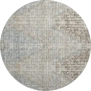 Photo of 8' Beige And Gray Geometric Washable Round Rug With UV Protection
