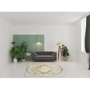 Photo of 8' Beige And Green Floral Medallion Distressed Round Rug