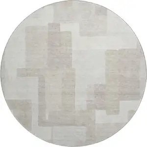 Photo of 8' Beige And Ivory Abstract Geometric Washable Round Rug With UV Protection