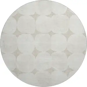 Photo of 8' Beige And Ivory Abstract Geometric Washable Round Rug With UV Protection