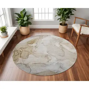 Photo of 8' Beige And Ivory Abstract Washable Round Rug With UV Protection