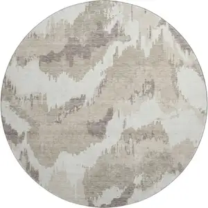 Photo of 8' Beige And Ivory Abstract Washable Round Rug With UV Protection