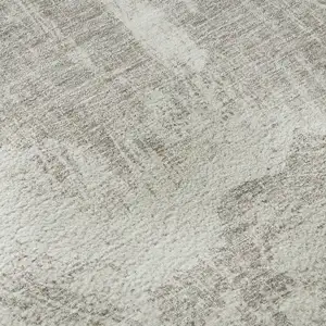 Photo of 8' Beige And Ivory Abstract Washable Round Rug With UV Protection