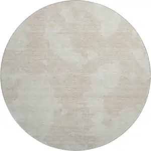 Photo of 8' Beige And Ivory Abstract Washable Round Rug With UV Protection