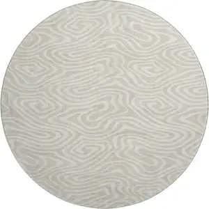 Photo of 8' Beige And Ivory Abstract Washable Round Rug With UV Protection